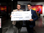 Carey Pawson-Edwards (L) receiving his prize winner’s cheque from Rabobank’s Marcel van Doremaele.