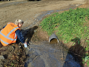 Waikato Regional Council staff test leachate discharging from stock feed bunker.