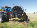 The Soilmax Gold Digger installs plastic dainage pipe at targeted depths.