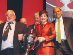 Chairman of Te Kaha 15B Hineora Orchard Norm Carter is presented with the Ahuwhenua Trophy by Governor General Dame Patsy Reddy, with Agriculture Minister Damien O'Connor and Maori Development Minister Willie Jackson also in attendance.