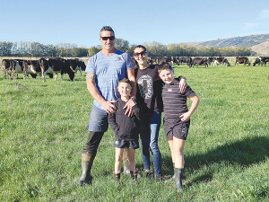 Taieri farmers James and Celia Aitken, with children Harvey (9), and Carlos (6), are heading for one of their best seasons on their farm.