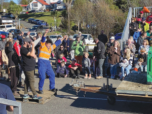 Kim Young cheering on teams in the growers games at Ohakune Carrot Festival.