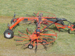 Kuhn GA 7631 semi-mounted rake with central delivery.