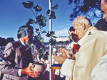 Dr Richard Smart presenting the vine planted by St Peter Chanel at Poi, Futuna Island, to Pope John Paul, Auckland, November 1986. 