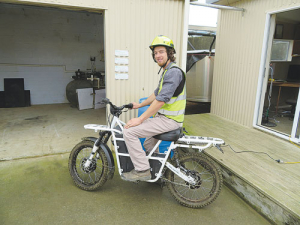 Quinton Scandrett on a farm bike that’s charged from a generator powered from effluent biogas.