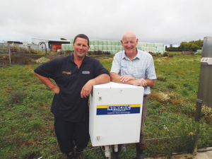 Farmer Joe McDonald (left) with Trevor Foley, Numedic on his farm.