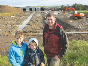 Padraig Og Mulligan and sons Kyle and Callum at the site of the proposed $1.3m rotary milking parlour.