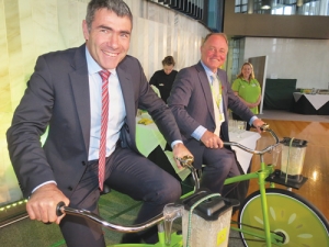 Peddling kiwifruit: Government ministers Nathan Guy and Craig Foss use pedal power to mix a kiwifruit smoothie at the recent parliamentary reception to celebrate the recovery of the kiwifruit industry.