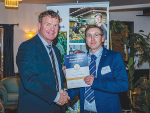 Darryl Oldham receives the award from Rabobank NZ chief executive Todd Charteris.