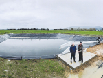 Tainui Group Holdings primary industries manager Mark Jackways (left) and Tainui Road Dairy manager Greg Boswell and an effluent storage pond on the farm.