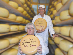 Albert Alferink and cheesemaker Thomas Frederickson with the winning Fifty Fifty cheese.