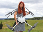 Linda Bulk, sales director at Aeronavics NZ, displays one of the many UAVs now available for on-farm use in New Zealand.