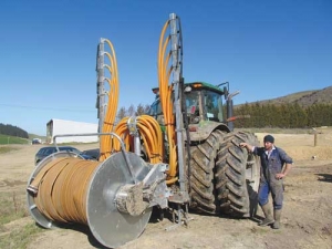 Ikawai Dairies machinery manager Perry Henriksen dropping off the Slurryquip reeler and dribble bar. 