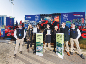 Power Farming staff with Fieldays chair Jenni Vernon after receiving their award.