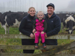 Luke Kane on his farm in Tapanui alongside wife Nicole and daughter Poppy.