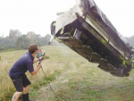 Waikato Regional Council biosecurity pest plants officer Ben Elliot cleans a machine after harvesting.