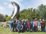 Ross MacMillan (kneeling, front) and his tour group take a break at Rakaia on the last day of their Mainland Muster farm tour of the South Island. Photo Credit: Nigel Malthus