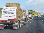 A convoy of trucks headed to Wellsford with fencing materials for cyclone-impacted farmers.