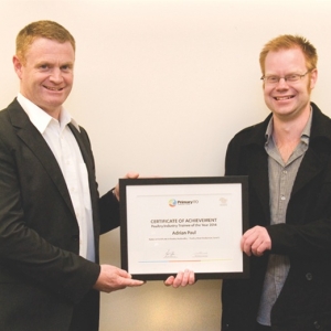 Adrian Paul, 2014 Poultry Trainee of the Year (right), receives his award.