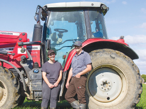 Manawatu dairy farmers Wendy and Richard Ridd with their Massey Ferguson 67135.
