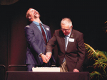 2017 Young Farmer of the Year Nigel Woodhead and his 1970 counterpart Allan Anderson cut the birthday cake at the competition’s 50th anniversary celebration.