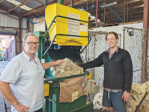 Yaldhurst Wools owner Ross McGuckin and his son Edward with the Heiniger-supplied TPW woolpress.