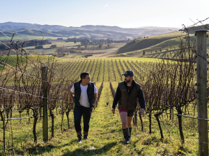 Ryan Higgs (left) with a winegrower at Greystone Vineyard in North Canterbury. Photo Credit: James Munro