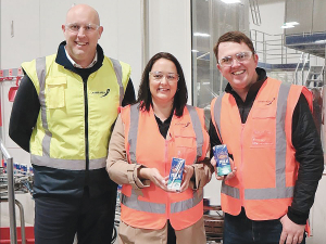 Miraka&#039;s Grant Jackson (left), Feed Out donor Hularau Farm&#039;s Lisa Kearins, and Feed Out&#039;s Wayne Langford celebrate the first production of milk, destined for Taupo district foodbanks.