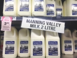 Woolworths has launched its milk label in Queensland, irking local dairy farmers.