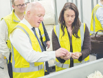 Prime Minister Christopher Luxon discusses the Keraplast keratin extraction process with the company’s operations manager, Lu Croft.