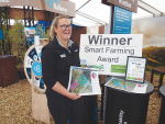 Erica Leadley, South Island regional manager of the Ballance Farm Sustainability Team, displays the award at SIAFD.