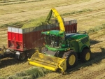 John Deere’s new 8300 series cuts fuel use by 15% when harvesting grass.