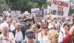 Oz politicians urged to repeal carbon tax