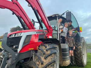 Rory and sons Cohen, Oliver, and Harry with the dream tractor.