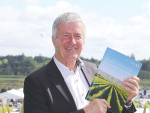 Agriculture Minister Damien O&#039;Connor pictured with a copy of the 2022 SOPI Report.