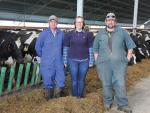 Brothers Mark (left) and TJ Stewart flank Mark&#039;s wife, Stacey, in the barn that has allowed them to remain on track with their production this season despite the crippling floods which forever buried 14.5ha of their Mid Canterbury farm under riverbed rubble in May 2021.