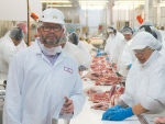 Taylor Preston chief executive Simon Gatenby beside the first shipment of NZ lamb being processed for the Iranian market in 25 years.