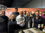 Prime Minister Christopher Luxon promotes the NZ Grown Grains logo with arable growers and industry people during a visit to Canterbury.