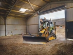 A JCB ICX-T levelling a barn.