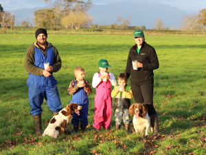: Dairy farmers Nic and Kirsty Verhoek and their children Ferguson, Isabelle and Lachlan raise glasses of milk to toast World Milk Day.