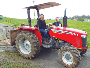 Chris and Susan Wollerton with their MF2615 tractor.