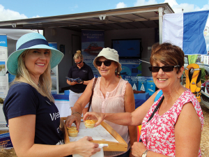 A tasty conversation starter - NRC staff hand out wild venison mini pies while connecting with visitors at a past Northland Field Days.