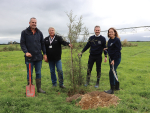From left, Cam Henderson, Sarah Mason, Synlait, Eric Gorlier and Katja Seidenschnur, Nestle, plant a South Island Kōwhai, the first of 90,000 native trees