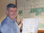 Nathan Guy with plans for his new $2million double rotary shed.