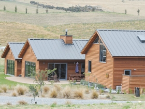Steel roofing system with a wide valley profile.