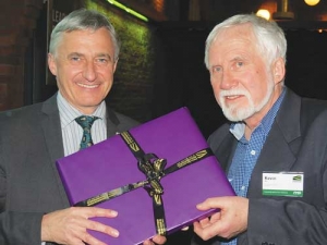Feds president William Rolleston presents Kevin Ikin with a little “thank you”.