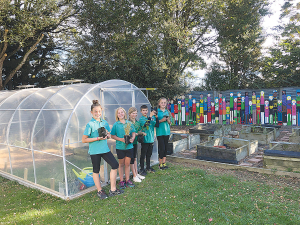 Students from Heddon Bush school in front of their new tunnel house.