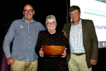 Mel Ewers with her award and flanked by NZAPI chair Andrew Gibbs (right) and Andrew Kininmonth.
