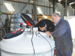 Doug and Logan McKee inspect a product at their Feilding site.