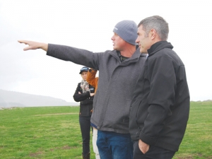 Omihi farmer Nick Hamilton points out the extent of drought damage on his property to Primary Industries Minister Nathan Guy.